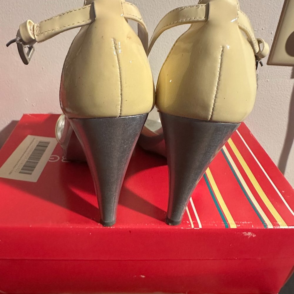 Beautiful BCBGirls White Patent heels with silver on the bottom  Size 7.5/ 37.5